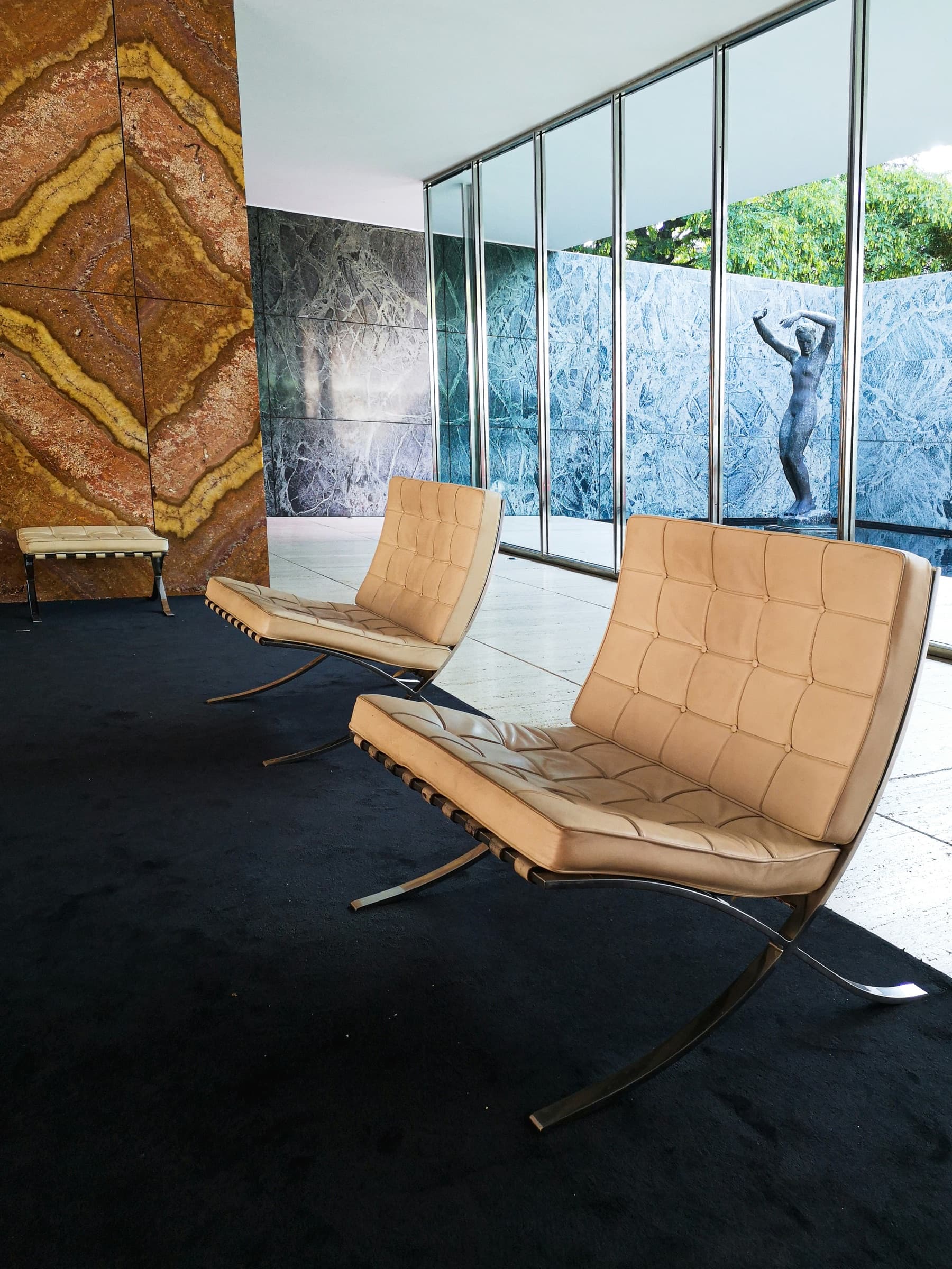 Timeless interior design: Barcelona chairs in tan leather with chrome frames
