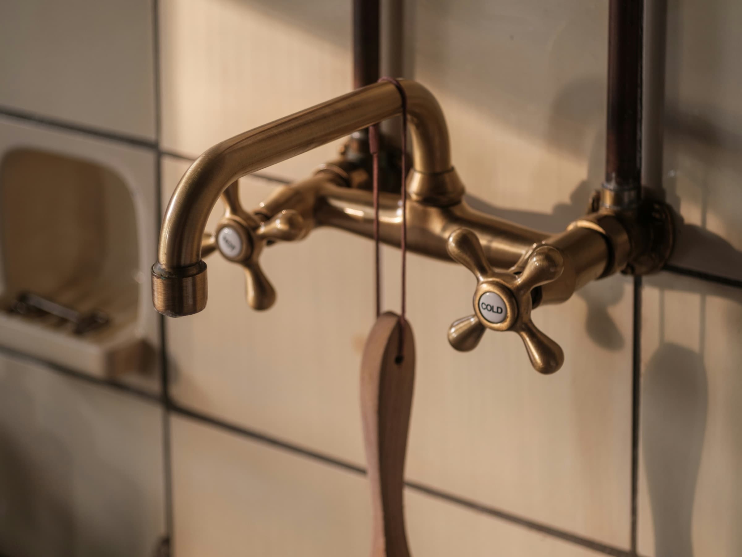 Timeless interior design: unlacquered brass tapware detail