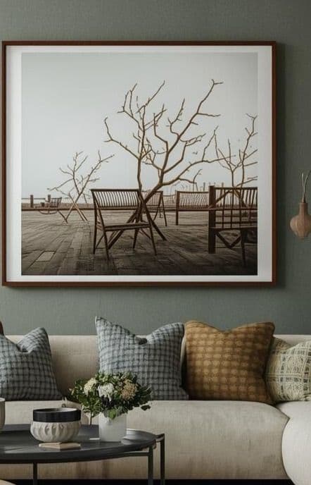Interior design Sydney: moody sage living room with layered textured cushions and large framed art (placeholder)
