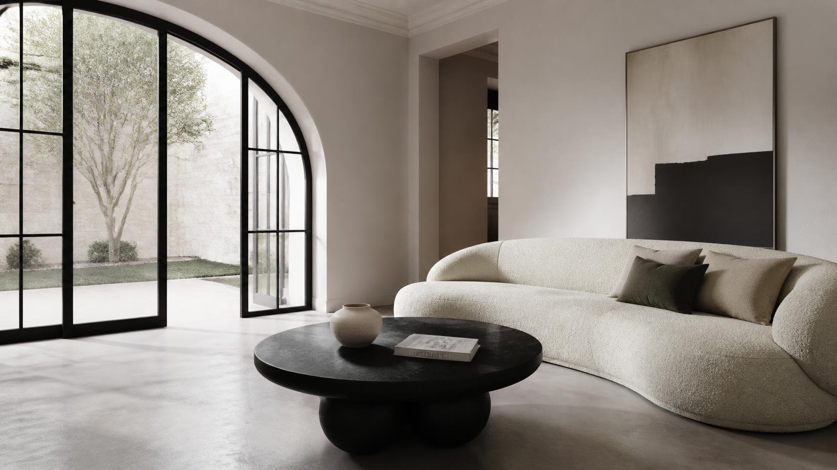 Interior design Sydney: living room with a curved bouclé sofa and sculptural coffee table